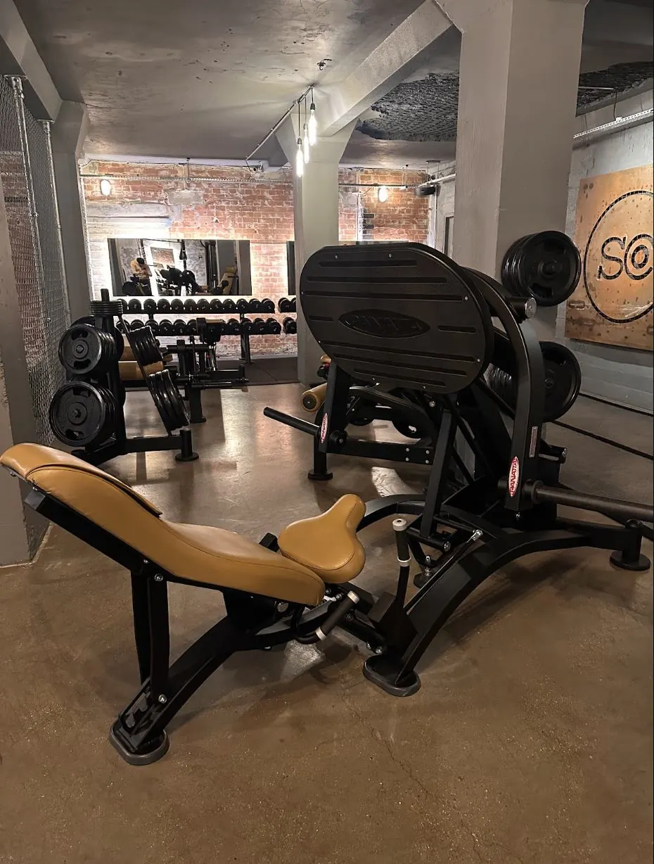 Amor Therapies and State of Change Clinic — Leg extension machine, tucked in among the free weights.